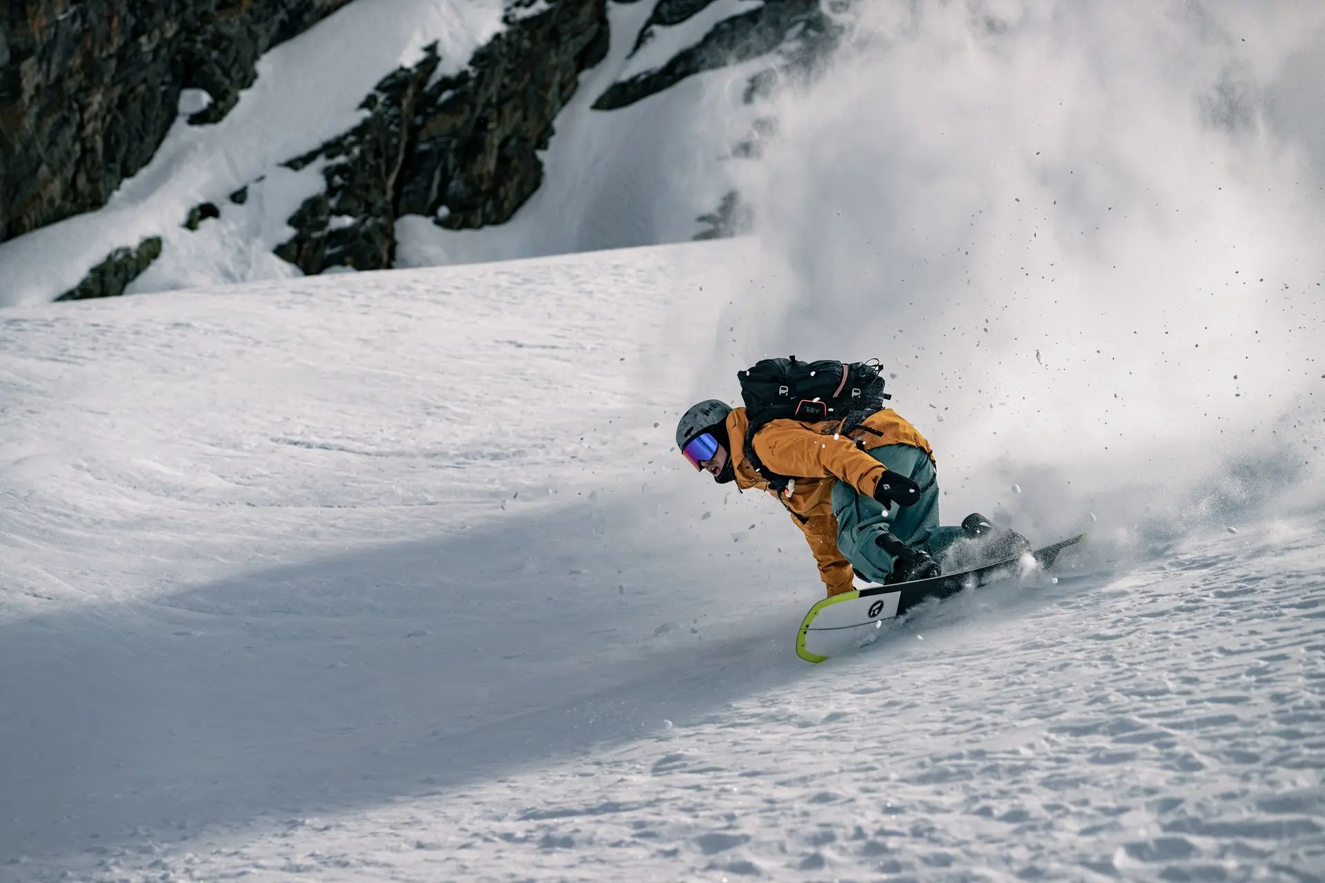 Snowboarder in action Penguin Powderwear